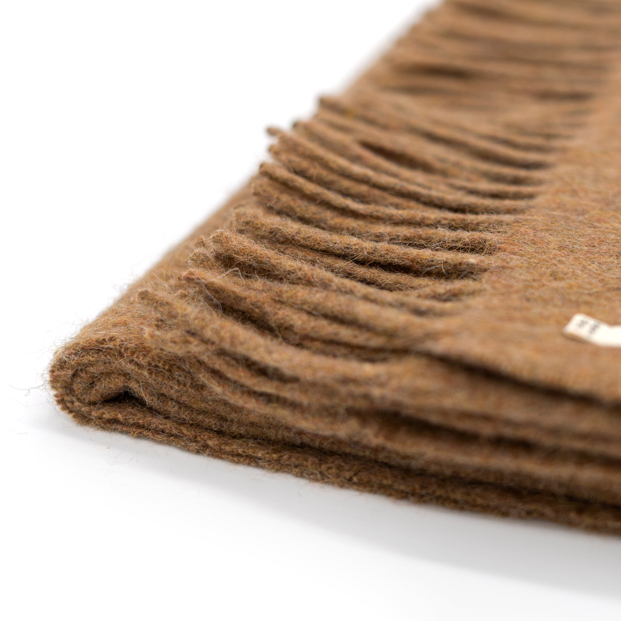Nachhaltige Kuscheldecke KAMINFEUER mit 40% Alpaka und 45% Schurwolle von Millwa