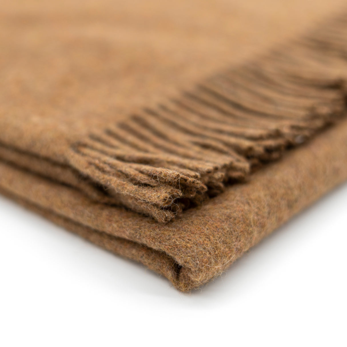 Nachhaltige Kuscheldecke KAMINFEUER mit 40% Alpaka und 45% Schurwolle von Millwa
